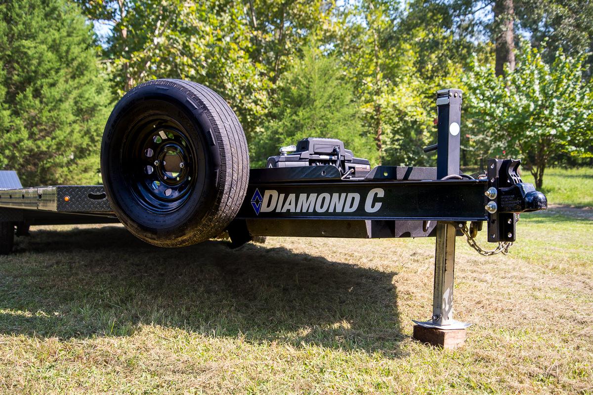 Heavy-duty trailer hitch connection on flatbed car hauler rental
